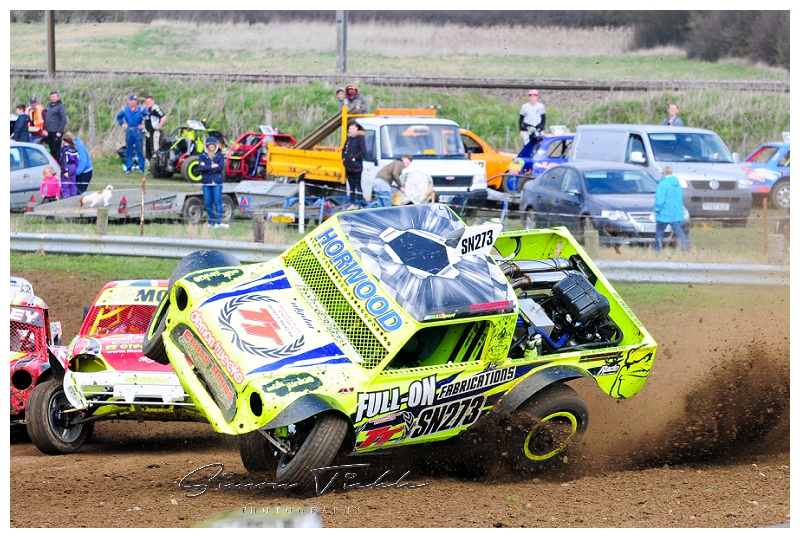 race car rolling over during race