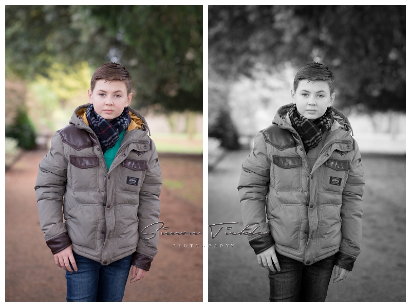 boy in jacket stands for the camera