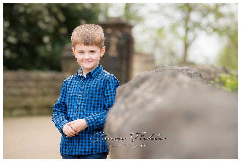 Boy in blue top stands naturally on bridge - child photo shoot mansfield